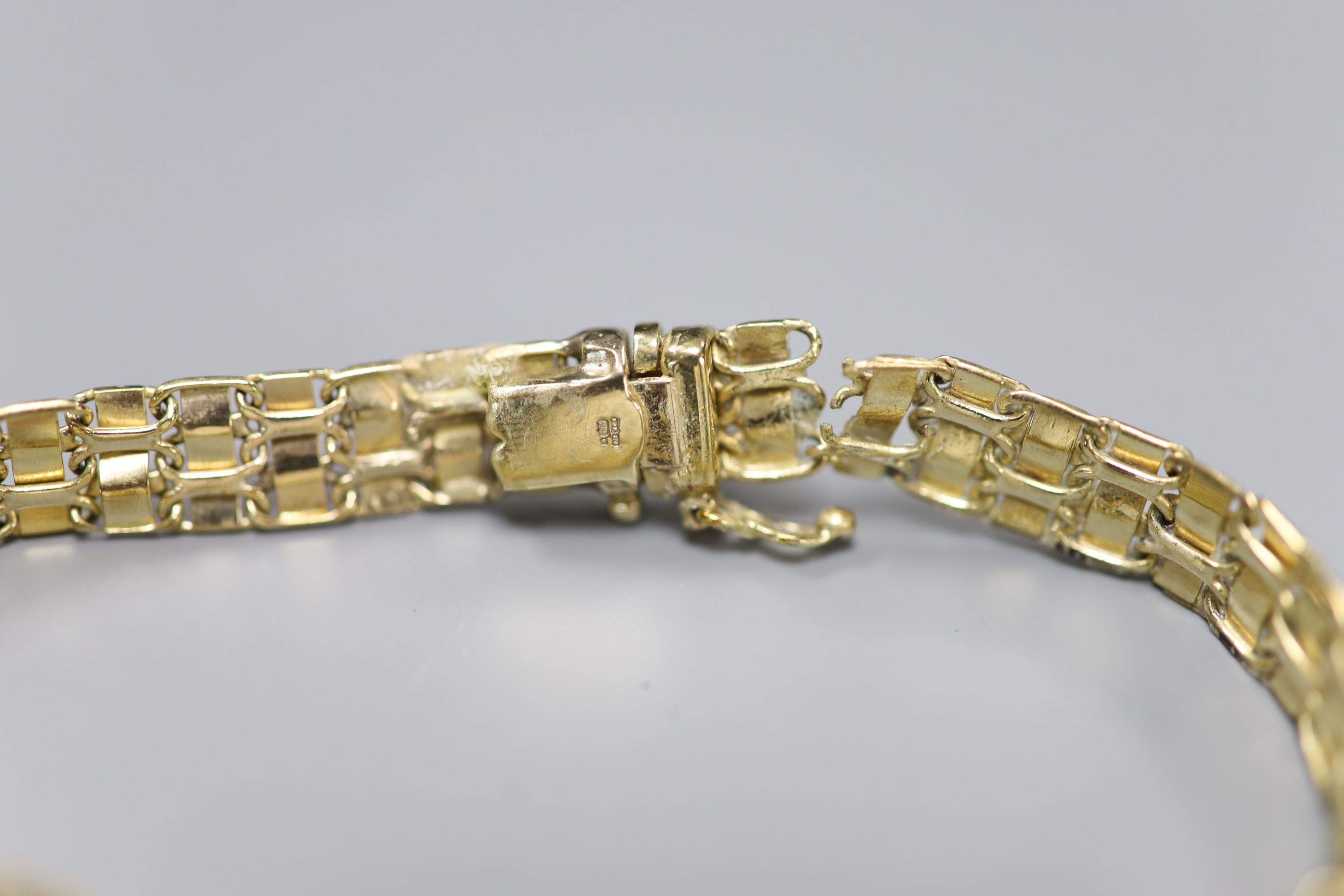 A 9ct plain and textured gold fancy link bracelet, 10.9g and a 585 yellow metal Greek key link bracelet (a.f.), 4.7g.